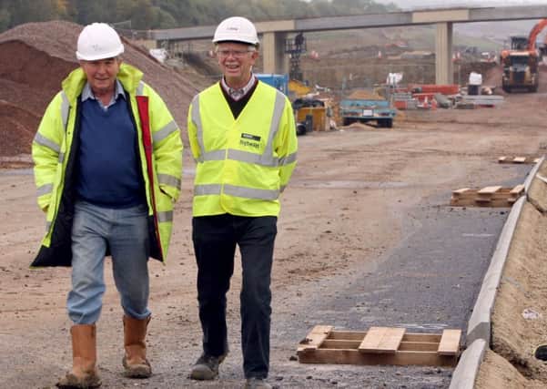 Then county council leader Jim Harker (right) with Cllr Stan Heggs during the construction of the link road.
