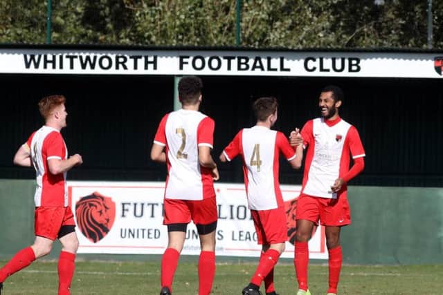 Remy Brittain takes the congratulations after he scored the first of his two goals in Whitworth's 2-1 victory over Harborough Town. Pictures by Alison Bagley