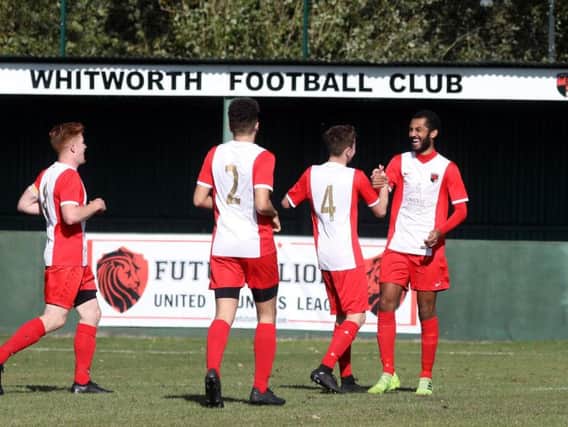 Remy Brittain takes the congratulations after he scored the first of his two goals in Whitworth's 2-1 victory over Harborough Town. Pictures by Alison Bagley