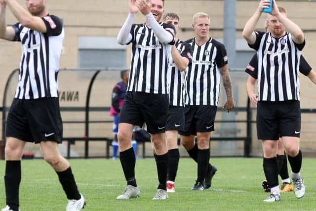 Corby Town captain Gary Mulligan (left) and his team-mates will be hoping to pull off an FA Cup upset at Stockport County this weekend