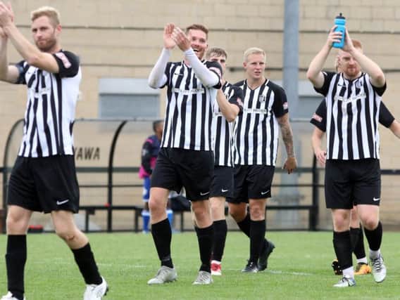 Corby Town captain Gary Mulligan (left) and his team-mates will be hoping to pull off an FA Cup upset at Stockport County this weekend