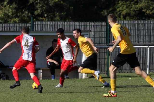 Action from Whitworth's 2-1 success over Harborough Town in the UCL Premier Division last Saturday. Picture by Alison Bagley