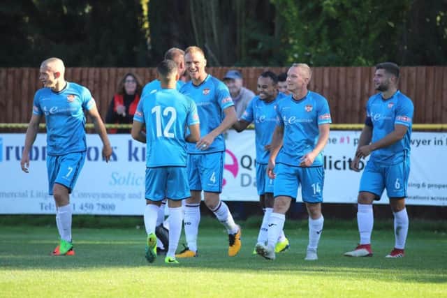 The Kettering Town players turn their attention to the Emirates FA Cup this weekend after maintaining top spot in the Evo-Stik League South Premier Division Central with a 3-1 win at Alvechurch last Saturday. Picture by Peter Short