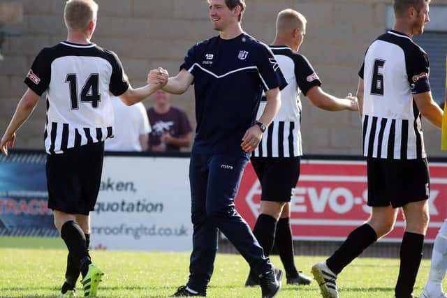 Steve Kinniburgh and his Corby Town players are eyeing an FA Cup upset at Stockport County this weekend