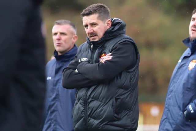 Marcus Law watches on during his team's win at Latimer Park