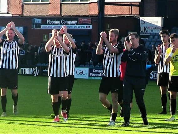The Corby Town players applaud their fans at the end of their 3-0 defeat at Stockport County in the FA Cup at the weekend. Picture by David Tilley