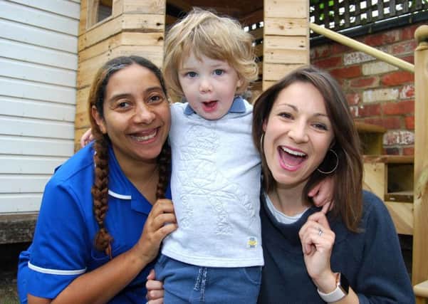 Midwife Serena Smith with Jasper, two, and mum Kelly