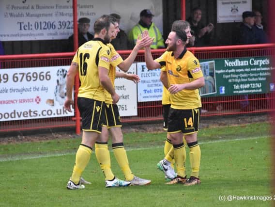 Albie Hopkins takes the congratulations after scoring AFC Rushden & Diamonds' fifth goal in the fine 5-1 success at Needham Market last weekend. Picture courtesy of HawkinsImages