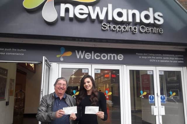 John Cecil with Newlands Shopping Centre's marketing manager Jodie Lockley with the cheque's. NNL-181210-140010005