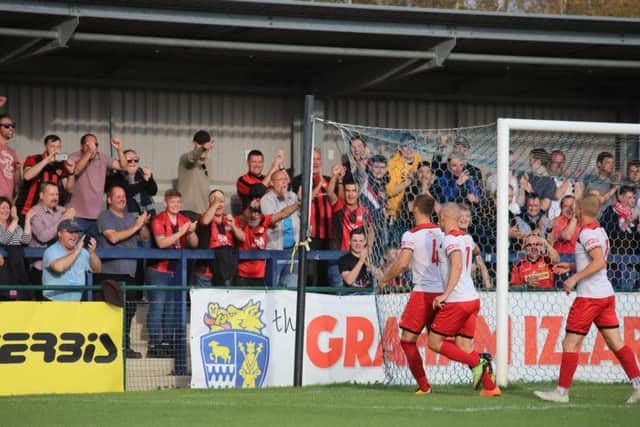 Brett Solkhon celebrates in front of the travelling Kettering Town fans after his penalty gave them the lead in their 3-0 win at St Neots Town. Picture by Peter Short