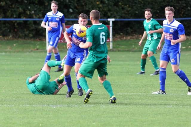 Action from the goalless draw between Thrapston Town and Blackstones in UCL Division One. Pictures by Alison Bagley