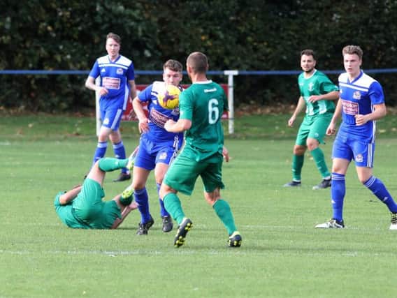 Action from the goalless draw between Thrapston Town and Blackstones in UCL Division One. Pictures by Alison Bagley