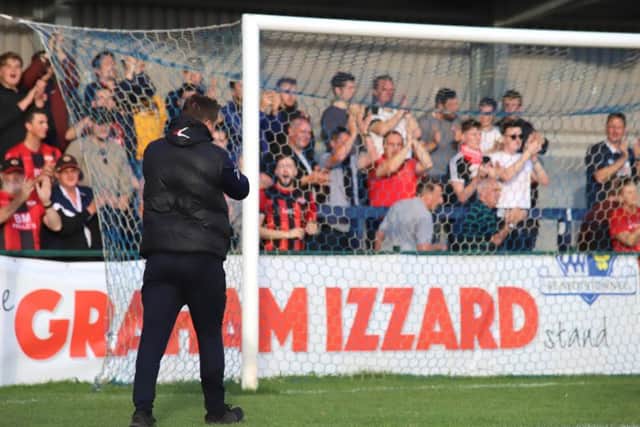 Marcus Law applauds the travelling fans after Kettering Town sealed a 3-0 victory at St Neots Town. Pictures by Peter Short
