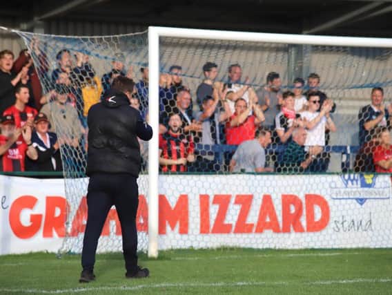 Marcus Law applauds the travelling fans after Kettering Town sealed a 3-0 victory at St Neots Town. Pictures by Peter Short