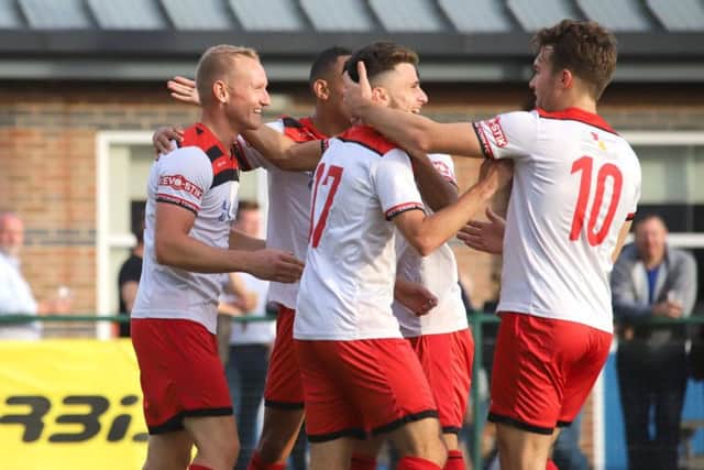 Marcus Kelly takes the congratulations after scoring Kettering's third goal at St Neots