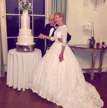 Pauline and Roddie cut the cake. NNL-181015-140726005
