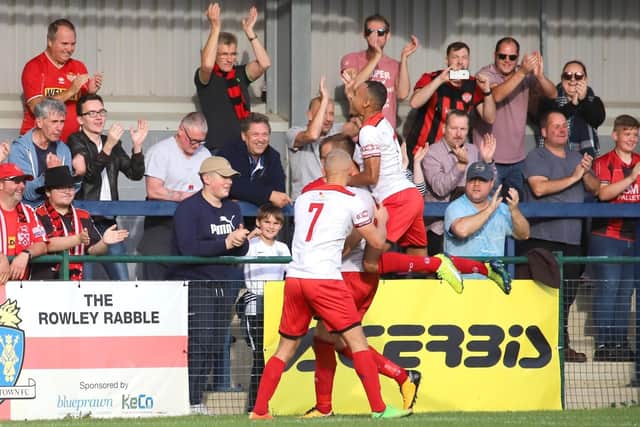 Brett Solkhon takes the congratulations after he opened the scoring in Kettering Town's 3-0 victory at St Neots Town on Saturday. Picture by Peter Short