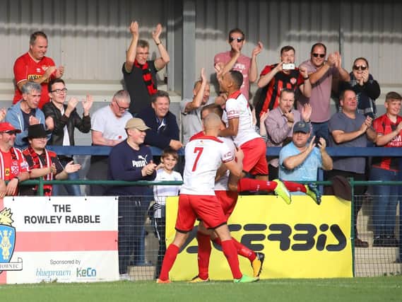 Brett Solkhon takes the congratulations after he opened the scoring in Kettering Town's 3-0 victory at St Neots Town on Saturday. Picture by Peter Short
