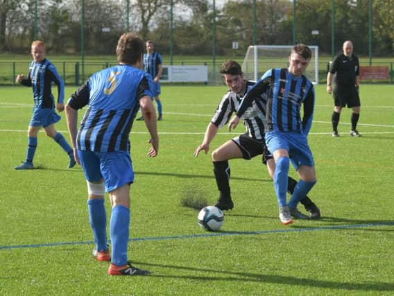 Action from Moultons 9-0 victory over Corby Pegasus. Picture by Dave Ikin
