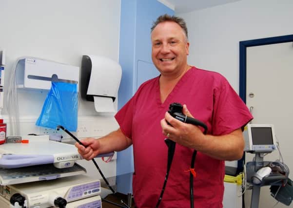 Kettering General Hospitals Clinical Director for Bowel Cancer Screening and Consultant Gastroenterologist Dr Andrew Dixon in the hospitals 5th Endoscopy Room. NNL-181018-123612005