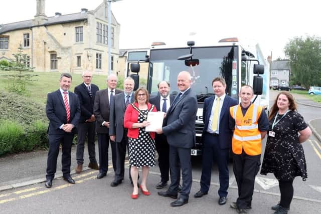 Representatives from FCC and East Northants Council with the new contract which only started this summer