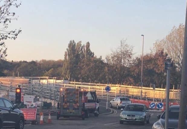 Cars finally cross the Cottingham Road bridge in Corby. Picture by reader Emma Magee. NNL-181019-172757005