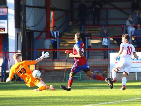 Ben Milnes is denied by Aldershot Town goalkeeper Will Mannion during Kettering Town's 2-0 defeat in the fourth qualifying round of the Emirates FA Cup. Pictures by Peter Short