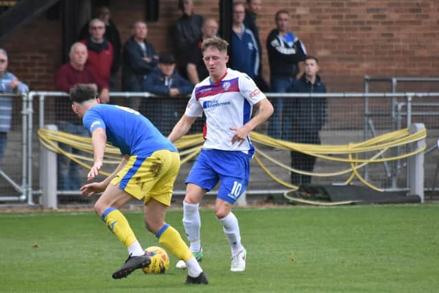 Ben Diamond runs at the King's Lynn defence