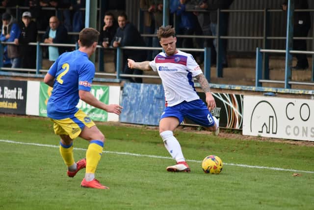 Goalscorer Declan Rogers delivers a ball from the left-hand side