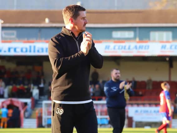 Marcus Law applauds the travelling fans after Kettering Town were beaten 2-0 at Aldershot Town in the fourth qualifying round of the Emirates FA Cup. Pictures by Peter Short