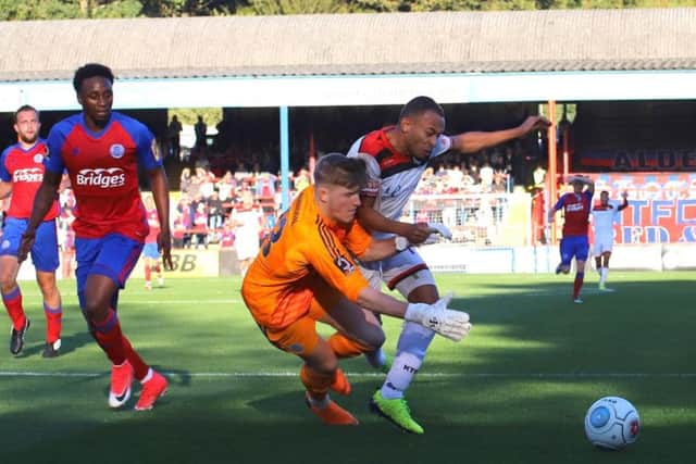 The Poppies felt they should have been awarded a penalty for this challenge by Aldershot goalkeeper Will Mannion on Rhys Hoenes