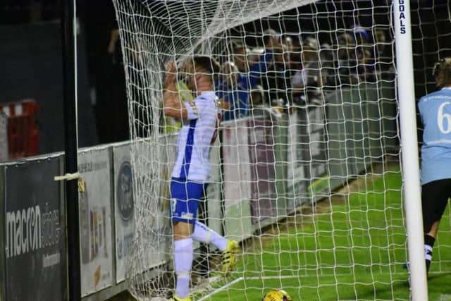 Ben Farrell follows the ball into the net after he opened the scoring in AFC Rushden & Diamonds victory over Coalville Town. Picture courtesy of HawkinsImages