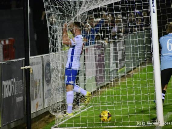 Ben Farrell follows the ball into the net after he opened the scoring in AFC Rushden & Diamonds victory over Coalville Town. Picture courtesy of HawkinsImages