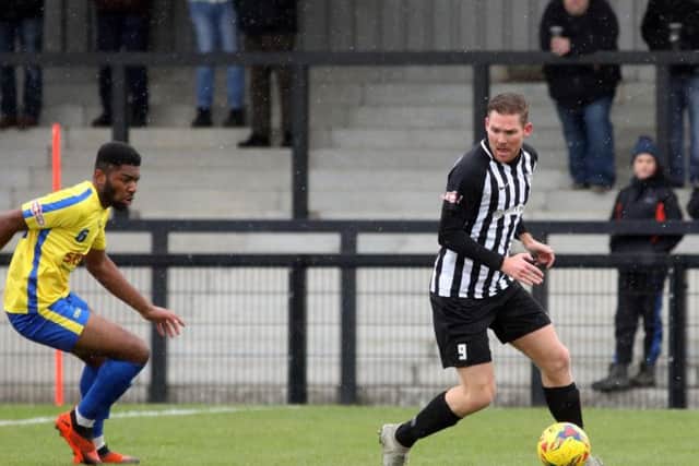 Elliot Sandy, who scored twice, takes control during Corby's win over Aylesbury FC