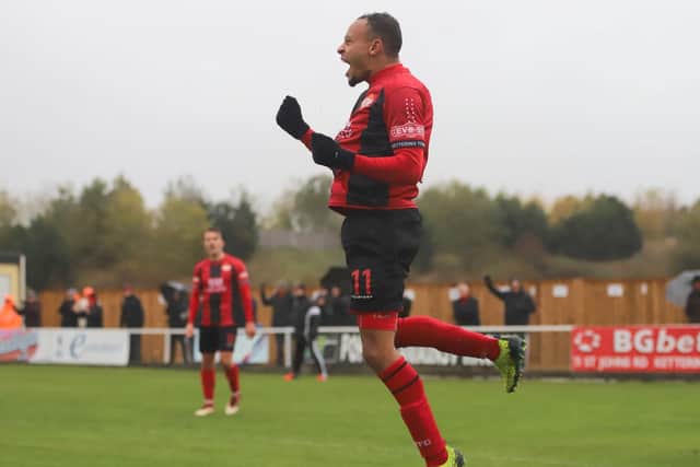Rhys Hoenes jumps for joy after scoring Kettering's second goal