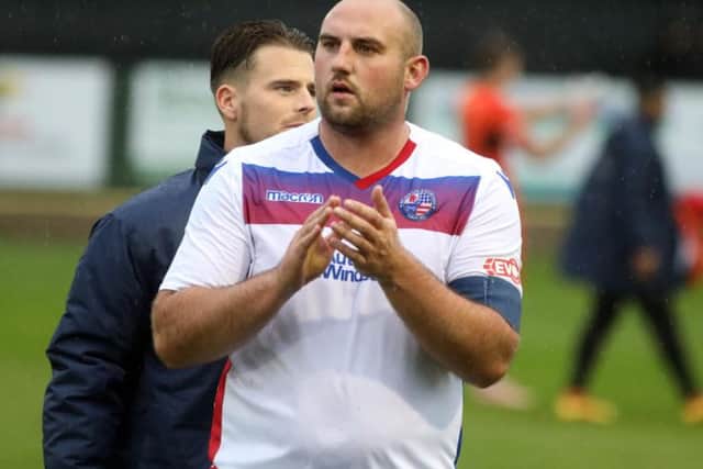 Diamonds captain Liam Dolman applauds the fans at the end of the game