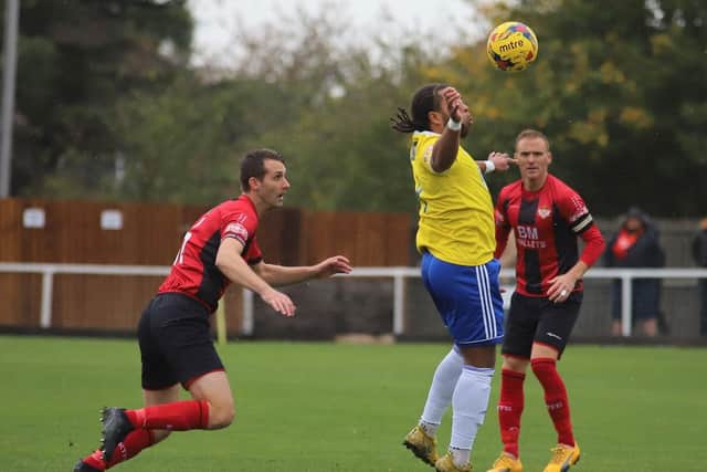 Luke Graham keeps tabs on Stourbridge's Luke Benbow during Kettering Town's Buildbase FA Trophy success at Latimer Park. Picture by Peter Short