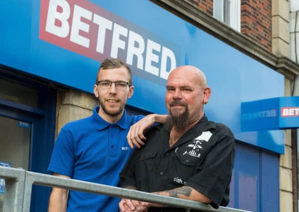 Tom Capps with Steve Patrick outside Betfred in Kettering