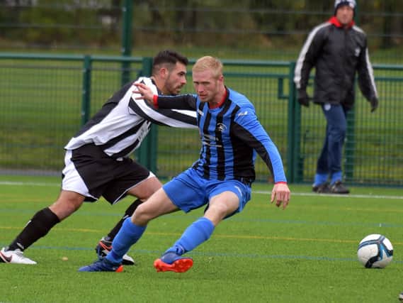 Action from Moulton's 6-0 victory over Corby Peagsus in the Premier Division. Picture by Dave Ikin