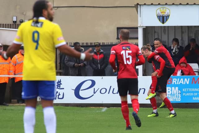Ben Toseland celebrates with Rhys Hoenes after he opened the scoring in Kettering Town's FA Trophy success over Stourbridge last weekend. Picture by Peter Short