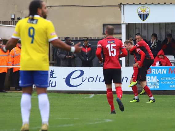 Ben Toseland celebrates with Rhys Hoenes after he opened the scoring in Kettering Town's FA Trophy success over Stourbridge last weekend. Picture by Peter Short