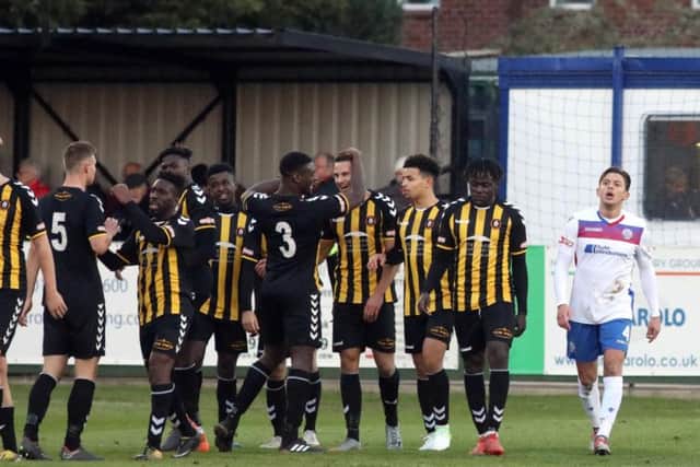 Jack Ashton cuts a frustrated figure as Rushall savour the moment after Ashley Sammons made it 2-0