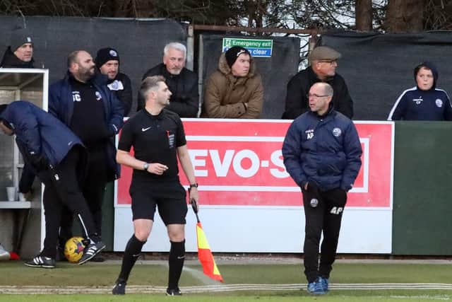 Andy Peaks has an exchange of views with the referee's assistant during AFC Rushden & Diamonds' 2-0 home loss to Rushall Olympic. Pictures by Alison Bagley
