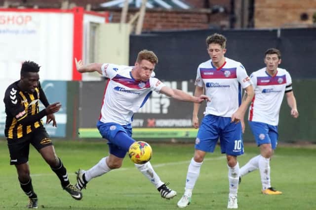 Ben Farrell gets on the ball in midfield for Diamonds
