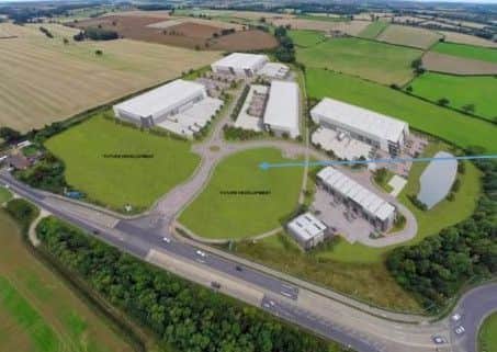 The store will be where the blue arrow points, fronting the A43.