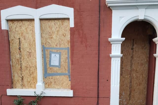 The boarded up house in Rushden