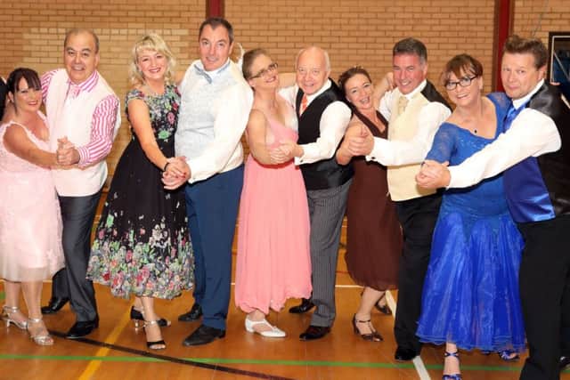 Five of the six dancers and their partners
