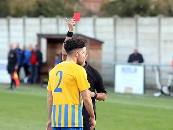 Wellingborough Towns Carlos Lewis is shown a red card in what was a crucial moment in his teams 7-0 home defeat to Tring Athletic in the second round of the Buildbase FA Vase at the Dog & Duck last weekend. Pictures by Alison Bagley