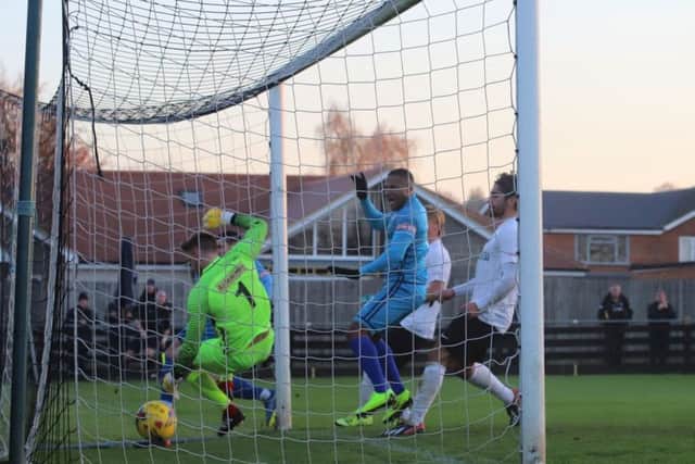 The ball is in the net after Dan Holman grabbed Kettering Town's goal in their fine 1-0 success at Royston Town. Pictures by Peter Short