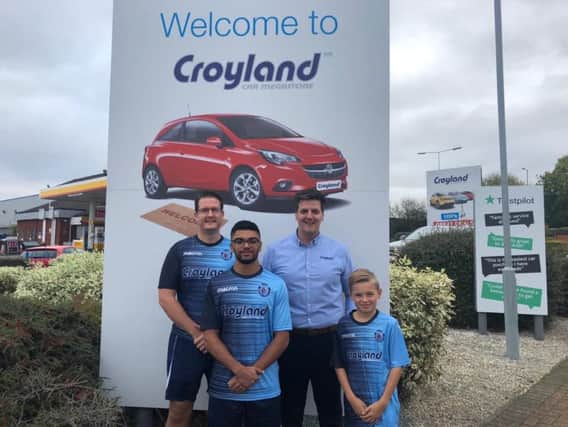Pictured with Croyland Car Megastore general manager Mark Swindells are Higham Town's vice-chairman James Sharp with players Josh Dhir and Brayden Mackness, who play in the adults and U9s teams